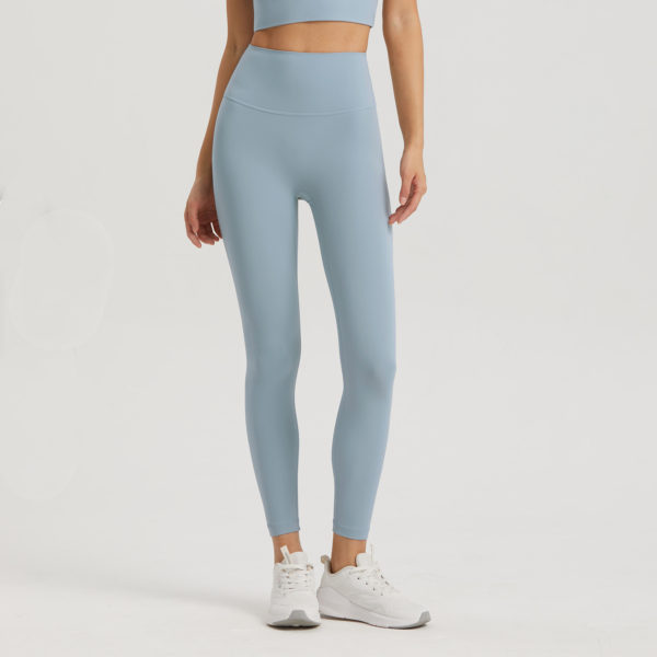 High-Waist Leggings, Pocket Fitness Fashion, Nine-Point Activewear, Trendy Workout Bottoms.