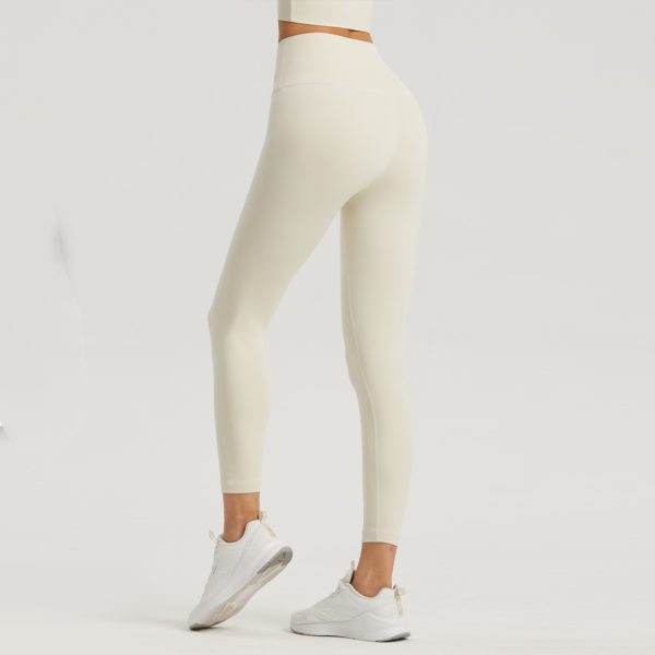 High-Waist Leggings, Pocket Fitness Fashion, Nine-Point Activewear, Trendy Workout Bottoms.